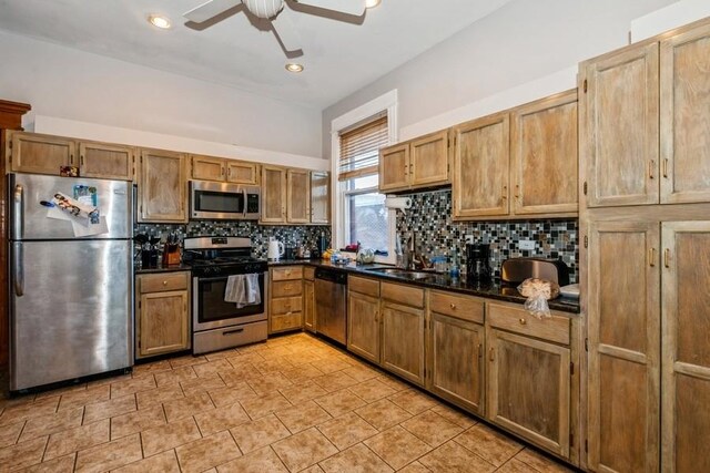 420 N Marion St, Oak Park, IL 60302 - kitchen with a sink, a ceiling fan, appliances with stainless steel finishes, decorative backsplash, and dark countertops