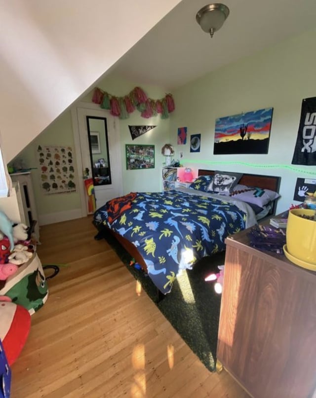420 N Marion St, Oak Park, IL 60302 - bedroom with lofted ceiling and wood finished floors