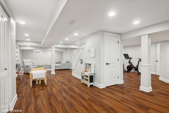 interior space with dark wood-type flooring, recessed lighting, and stairway