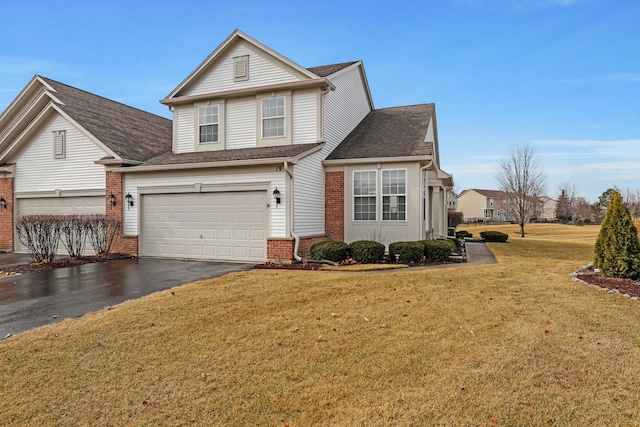 traditional home with an attached garage, brick siding, driveway, roof with shingles, and a front yard