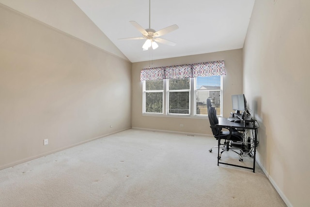 carpeted office with vaulted ceiling, ceiling fan, and baseboards