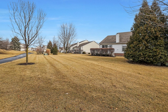 view of yard featuring a residential view