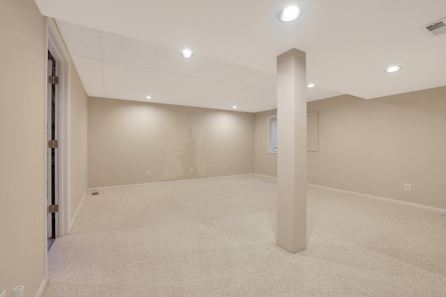 finished basement with carpet floors, baseboards, visible vents, and recessed lighting