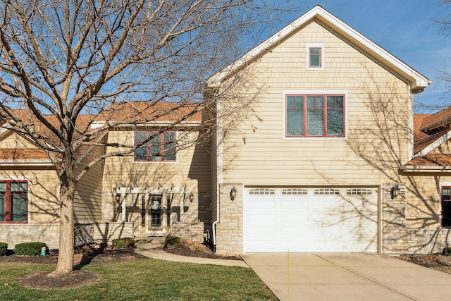 view of front of home with a garage and concrete driveway