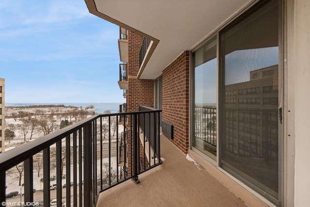 balcony featuring a water view