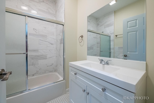 bathroom with bath / shower combo with glass door and vanity