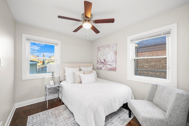 bedroom with dark wood-type flooring and ceiling fan