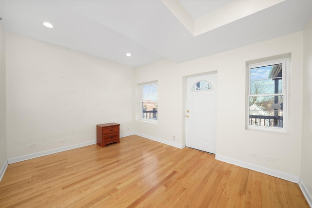 entrance foyer featuring light wood finished floors, baseboards, and recessed lighting