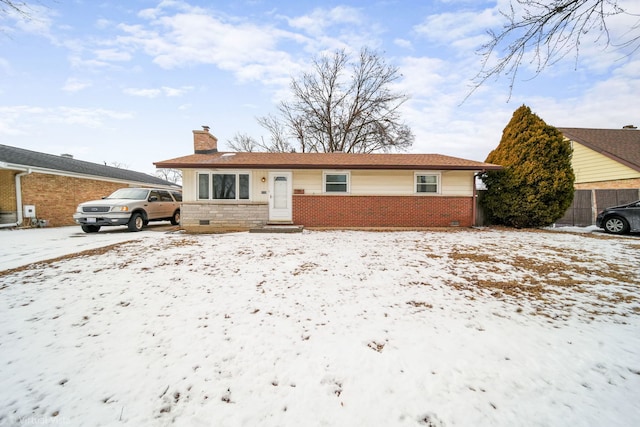 ranch-style house with a garage, crawl space, brick siding, and a chimney