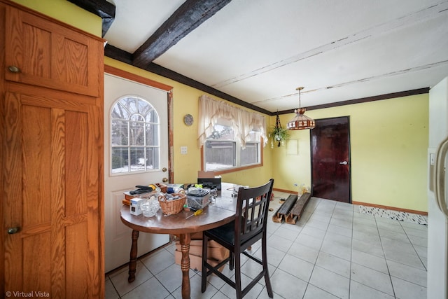 dining space featuring light tile patterned flooring, beam ceiling, and baseboards