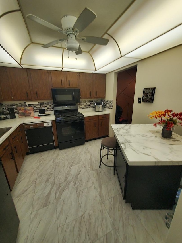 kitchen featuring sink, backsplash, ceiling fan, and black appliances