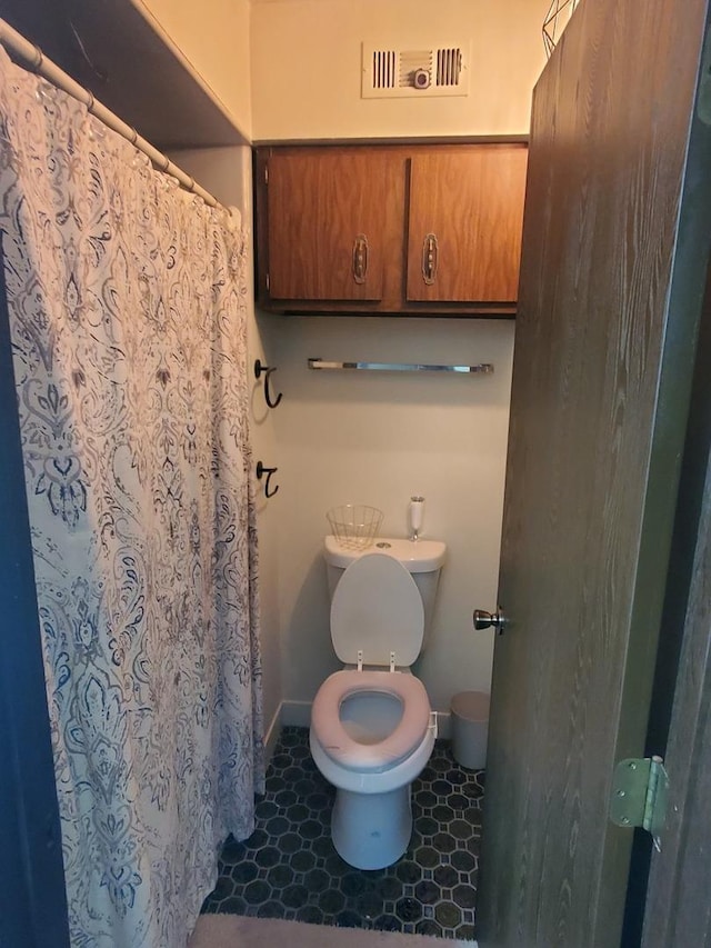 bathroom featuring toilet