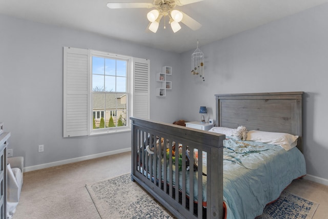 bedroom featuring ceiling fan, carpet, and baseboards