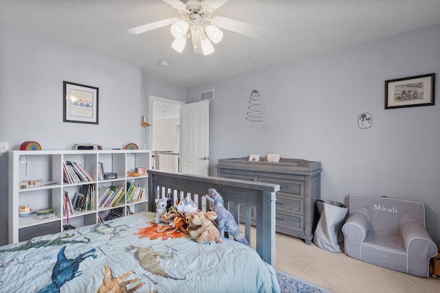 bedroom featuring carpet floors, visible vents, and ceiling fan