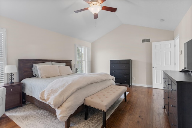 bedroom with baseboards, visible vents, lofted ceiling, dark wood-style floors, and ceiling fan