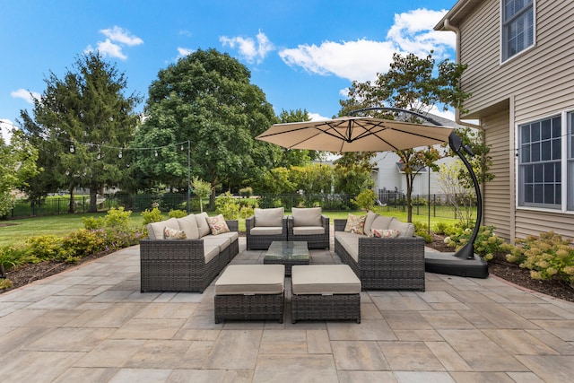 view of patio featuring a fenced backyard and an outdoor living space