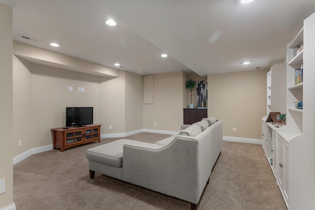 living area featuring light carpet, baseboards, visible vents, and recessed lighting