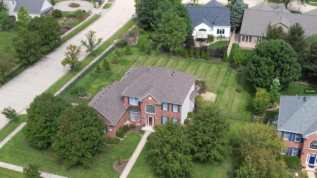 birds eye view of property with a residential view