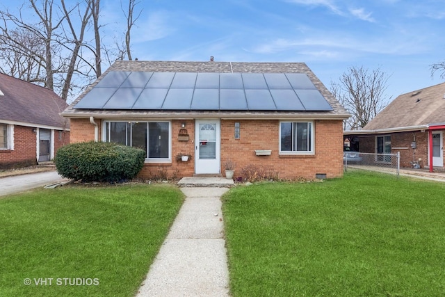 bungalow with a front yard and solar panels