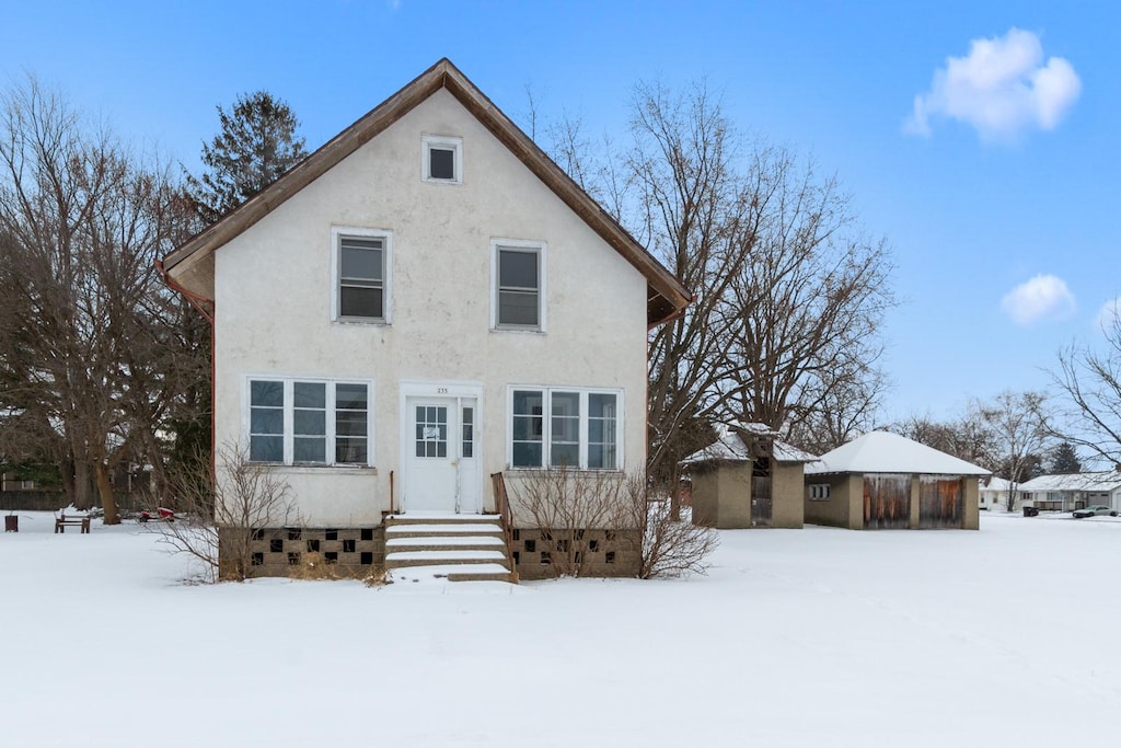 view of snow covered house