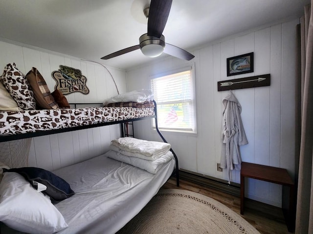 bedroom with ceiling fan and wood-type flooring