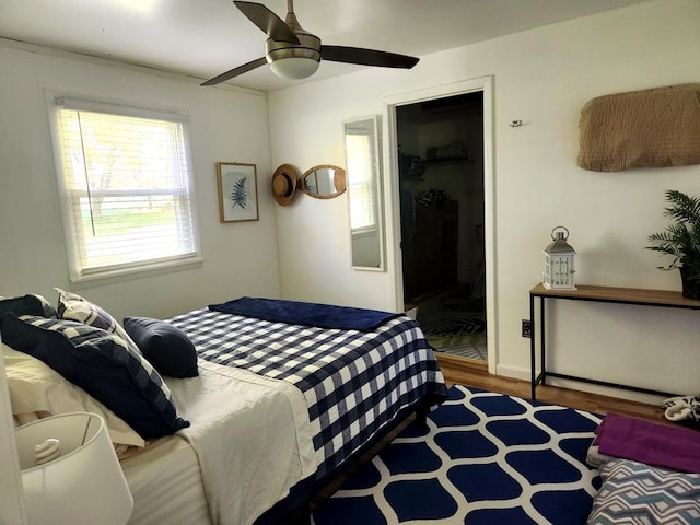 bedroom featuring ceiling fan and hardwood / wood-style floors