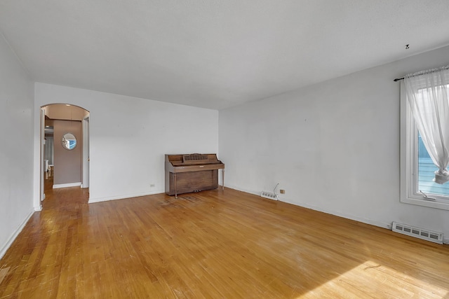 unfurnished living room with light hardwood / wood-style flooring