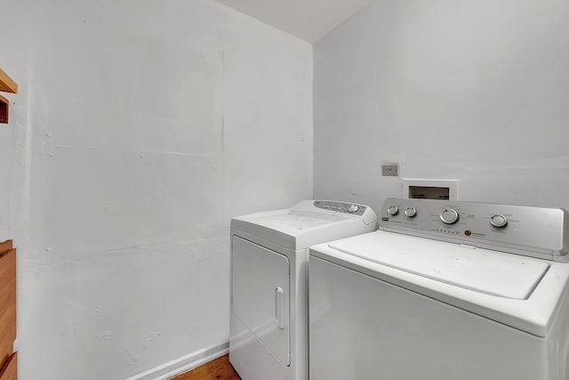 washroom with independent washer and dryer