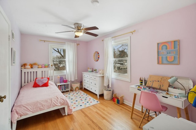 bedroom featuring ceiling fan and light hardwood / wood-style floors