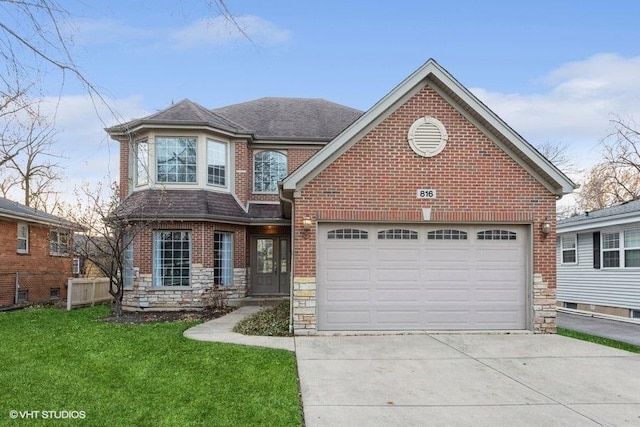 view of front of home featuring a garage, brick siding, stone siding, concrete driveway, and a front yard