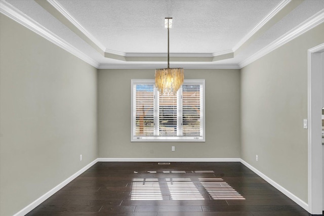 unfurnished room featuring dark wood-style floors, a textured ceiling, and baseboards