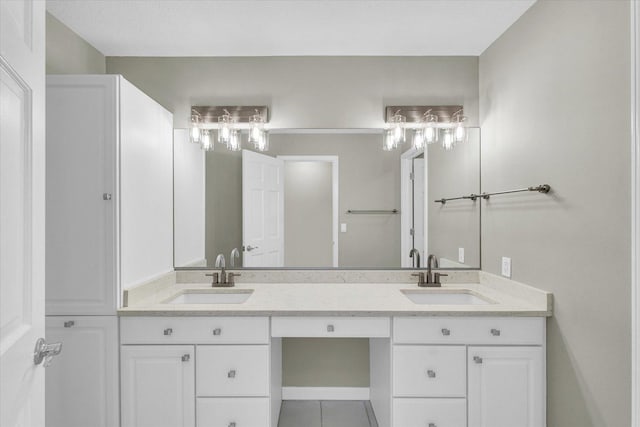 full bath featuring tile patterned floors, a sink, and double vanity