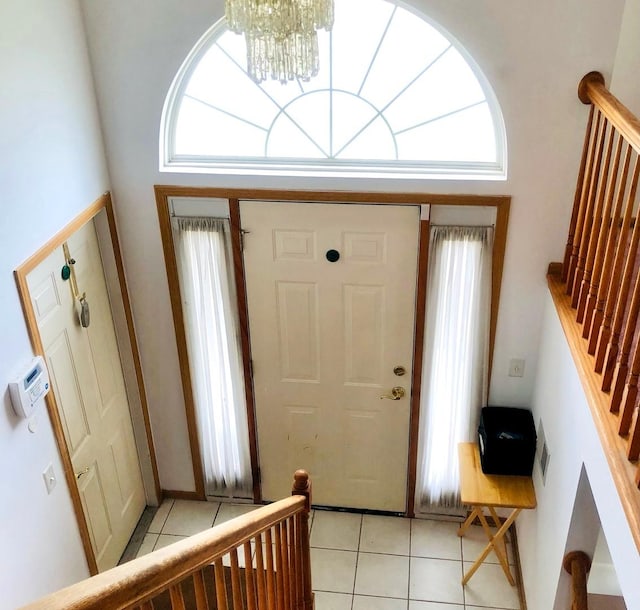 3469 W 155th St, Markham, IL 60428 - foyer entrance featuring light tile patterned floors, stairway, a healthy amount of sunlight, and a notable chandelier