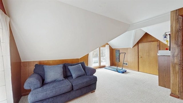 bonus room with light carpet, vaulted ceiling, and wooden walls