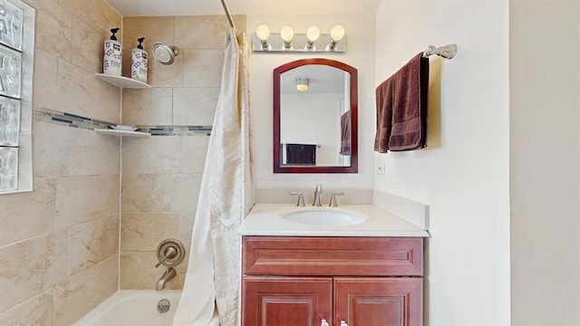 bathroom with shower / bath combo and vanity