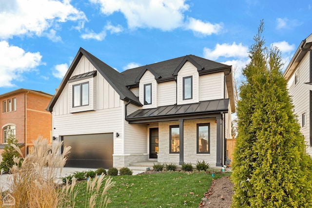 modern inspired farmhouse featuring a porch, metal roof, a standing seam roof, a front lawn, and board and batten siding