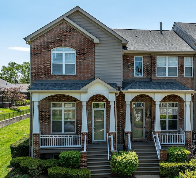 6074 Ironwood Ln, Lisle, IL 60532 - view of front facade featuring a porch, roof with shingles, fence, and brick siding