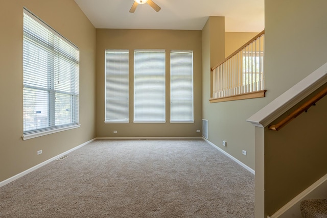 6074 Ironwood Ln, Lisle, IL 60532 - spare room with ceiling fan, carpet flooring, baseboards, and stairs