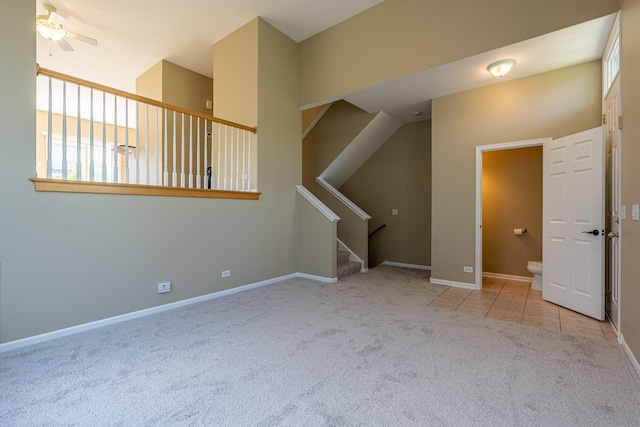 6074 Ironwood Ln, Lisle, IL 60532 - unfurnished living room featuring carpet floors, stairway, baseboards, and tile patterned floors