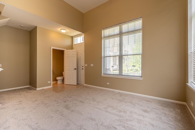 6074 Ironwood Ln, Lisle, IL 60532 - spare room with light carpet and baseboards