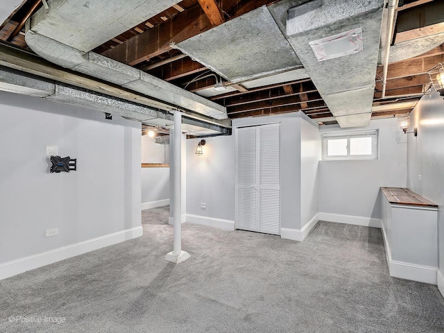 basement with carpet floors and baseboards