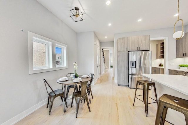 dining space with light hardwood / wood-style flooring