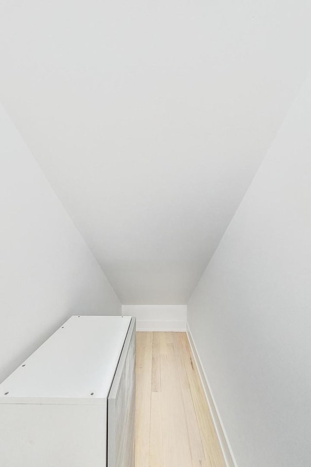 laundry area with light wood-type flooring