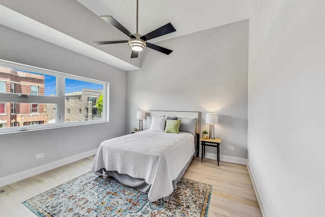 bedroom with ceiling fan and light hardwood / wood-style floors