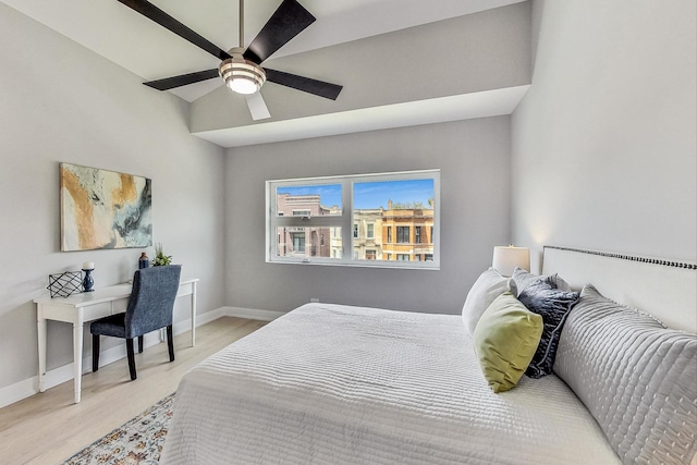 bedroom with light hardwood / wood-style flooring and ceiling fan