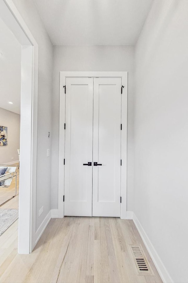 doorway to outside with light wood-type flooring