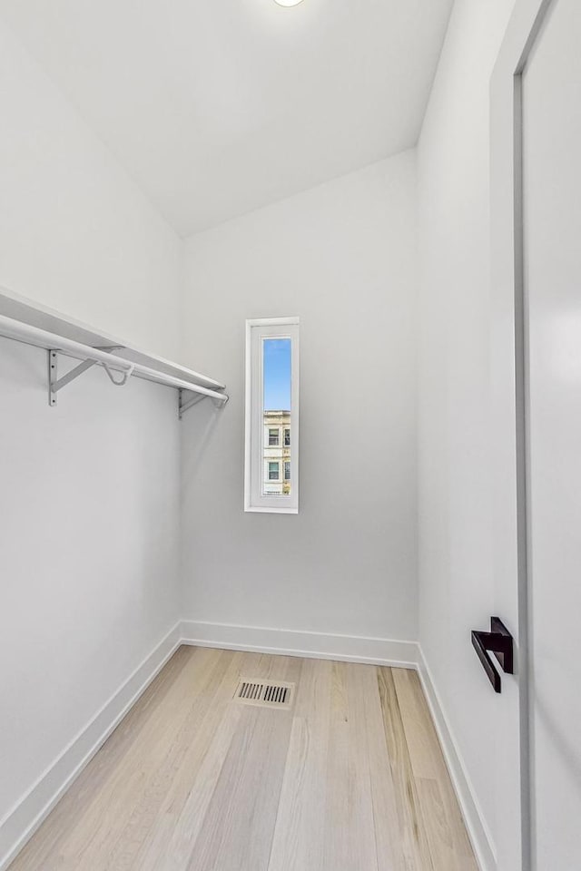 spacious closet featuring light wood-type flooring