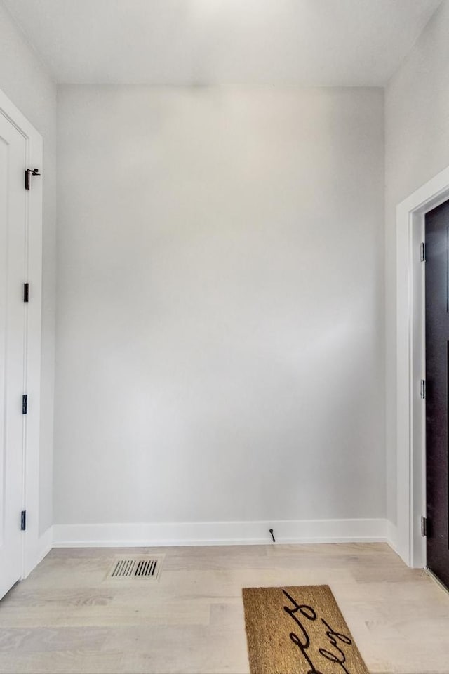 spare room featuring light hardwood / wood-style flooring