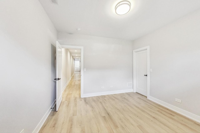 unfurnished room with light hardwood / wood-style floors