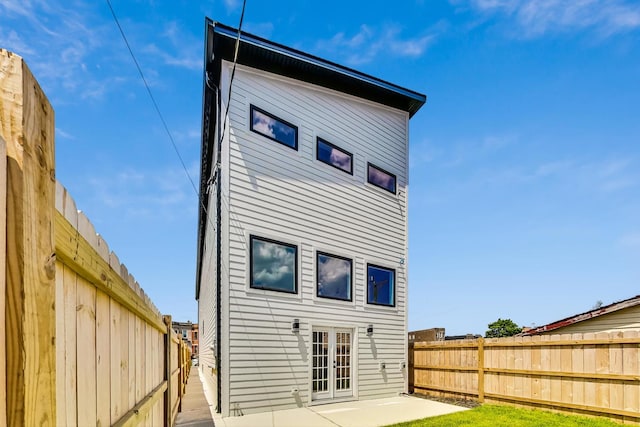 rear view of property with a patio and french doors